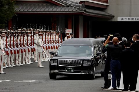 A vehicle carrying the body of the late former Japanese Prime Minister Shinzo Abe, who was shot while campaigning for a parliamentary election, leaves after his funeral at Zojoji Temple in Tokyo, Japan July 12, 2022. REUTERS/Issei Kato