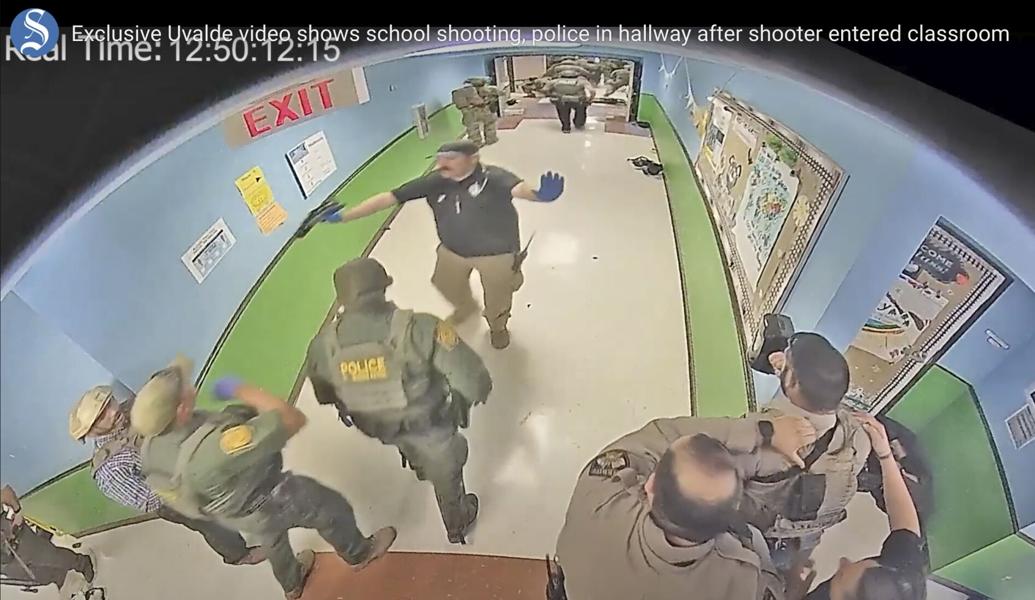In this photo from surveillance video provided by the Uvalde Consolidated Independent School District via the Austin American-Statesman, authorities respond to the shooting at Robb Elementary School in Uvalde, Texas, Tuesday, May 24, 2022.
