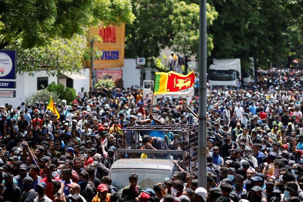 Demonstrators gather outside the office of Sri Lanka's Prime Minister Ranil Wickremesinghe, amid the country's economic crisis, in Colombo, Sri Lanka July 13, 2022. REUTERS/Adnan Abidi