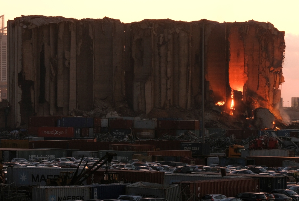 A view shows fire in Beirut grain silos damaged in the August 2020 port blast in Beirut, Lebanon, July 13, 2022. (REUTERS/Emilie Madi)