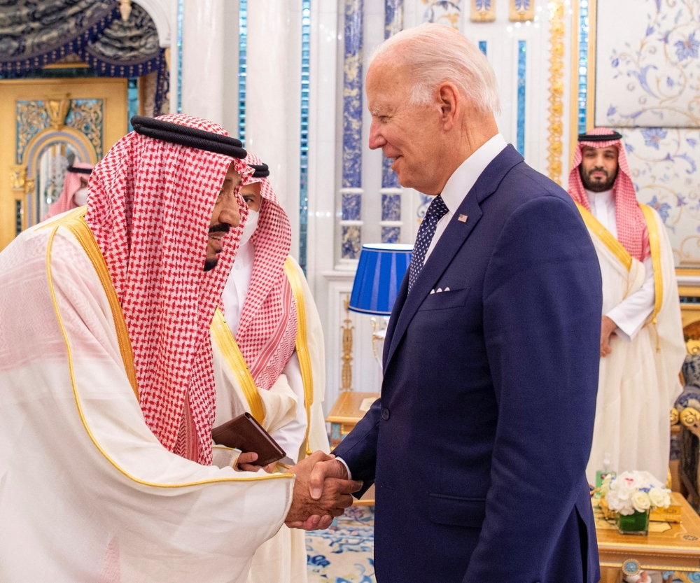 The Custodian of the Two Holy Mosques King Salman bin Abdulaziz Al Saud receives US President Joe Biden with a handshake at Al Salman Palace upon his arrival in Jeddah, Saudi Arabia, on July 15, 2022. (Photo: Bandar Algaloud/Courtesy of Saudi Royal Court via Reuters)
