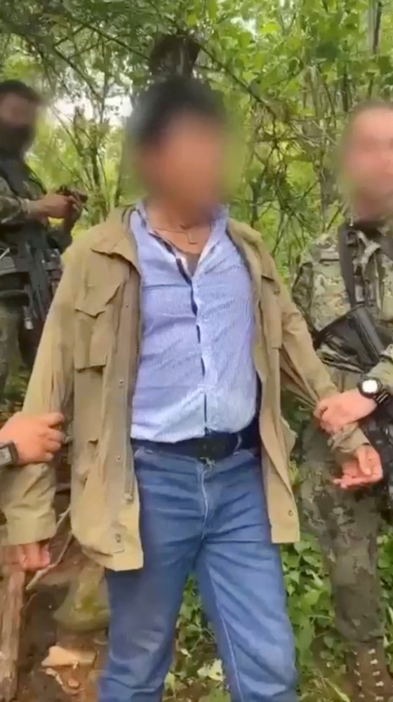A picture of Rafael Caro Quintero, after he got detained, in Sinaloa state, Mexico, in this screengrab obtained from a video on July 15, 2022. Subject's face blurred at source. Mexican Navy/Handout via REUTERS ATTENTION EDITORS 
