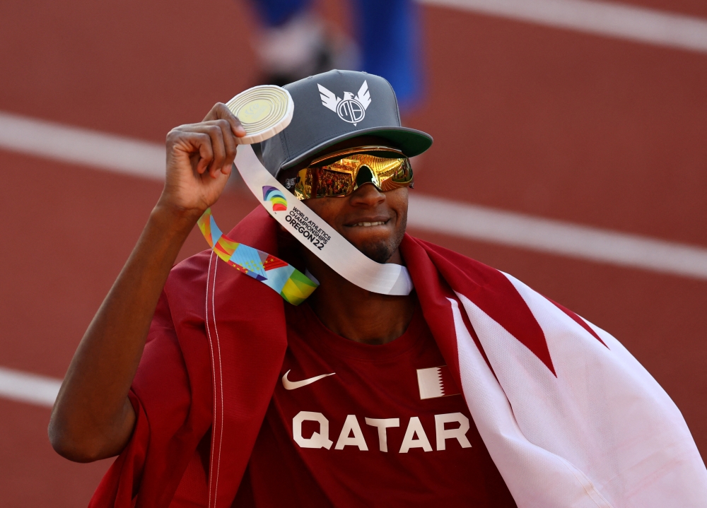 July 18, 2022 Qatar's Mutaz Essa Barshim celebrate winning gold in the men's high jump final REUTERS/Mike Segar