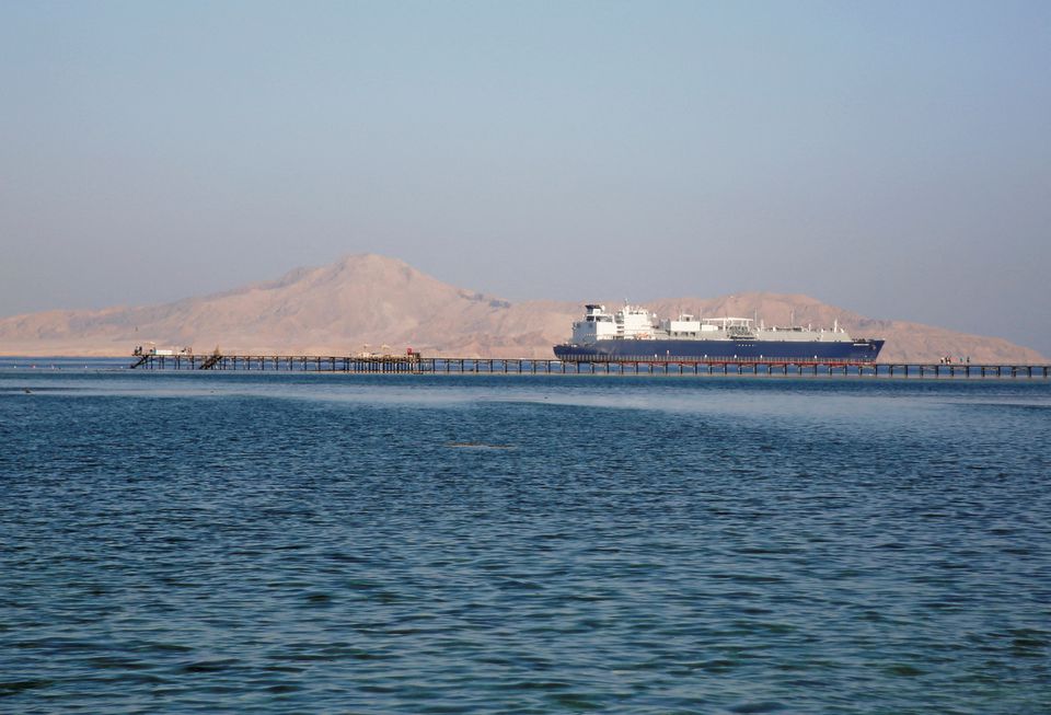 A container ship passes by a beach in the Aqaba Gulf in front of Tiran island which transferred into Saudi Arabia in 2017 off the Red Sea resort of Sharm el-Sheikh, Egypt July 12, 2018. REUTERS/Amr Abdallah Dalsh


