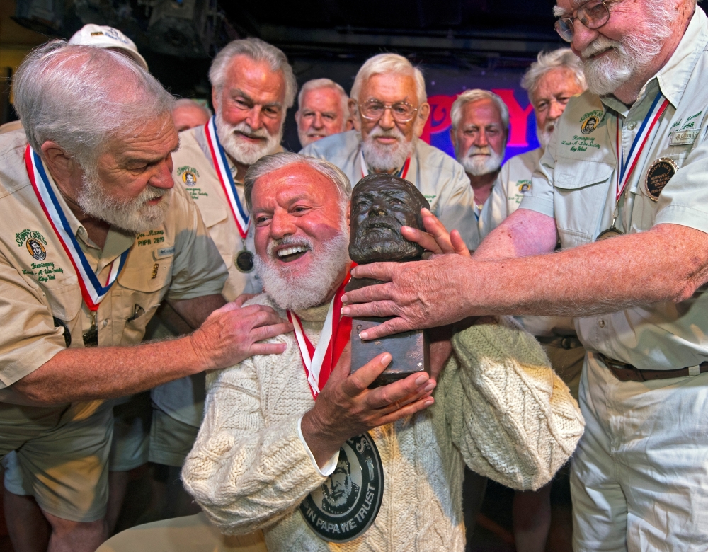 Jon Auvil, receives an Ernest Hemingway bust and congratulations after he won the 2022 Hemingway Look-Alike Contest, at Sloppy Joe's Bar in Key West, Florida, US July 23, 2022. (Reuters)