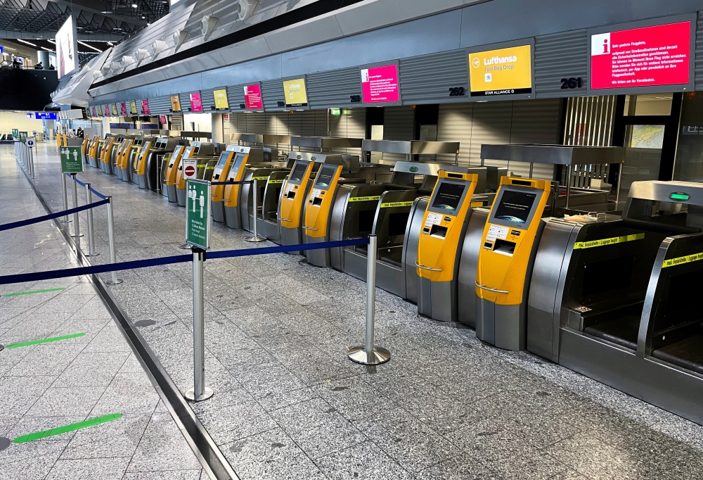 Empty counters of German airline Lufthansa at Frankfurt Airport are pictured during a strike of security staff at various German airports, March 15, 2022. (REUTERS/Timm Reichert/File Photo)