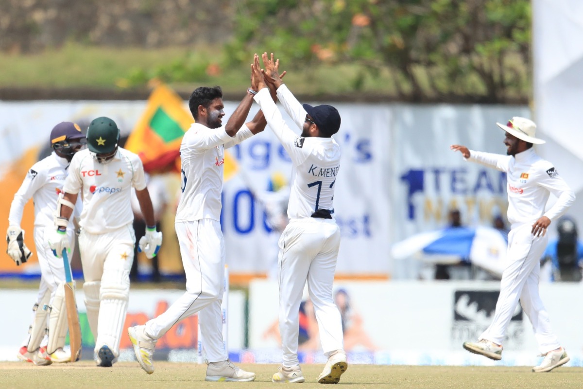 Sri Lanka's Ramesh Mendis celebrates with team-mates after taking the wicket during the second day of the second Test match against Pakistan at the Galle International Cricket Stadium in Galle on July 25. (Picture: Sri Lanka Cricket)