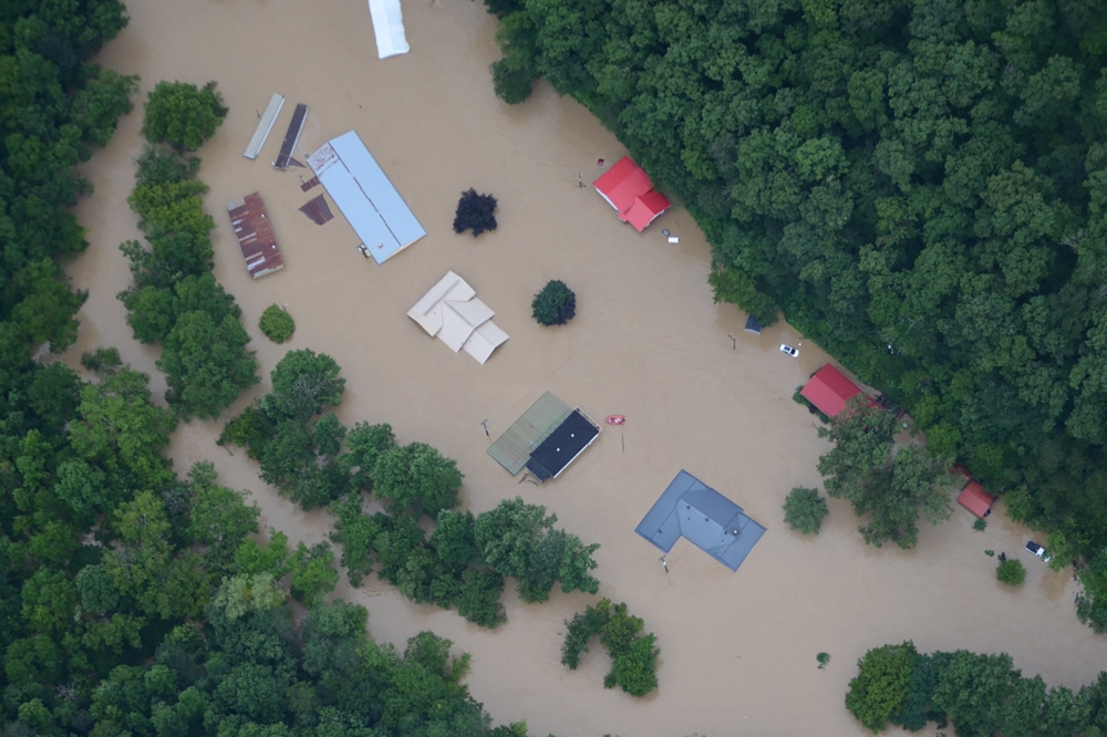 :A flooded area is flown over by a Kentucky National Guard helicopter deployed in response to a declared state of emergency in eastern Kentucky, U.S. July 27, 2022. U.S. Army National Guard/Handout via REUTERS THIS IMAGE HAS BEEN SUPPLIED BY A THIRD PARTY.