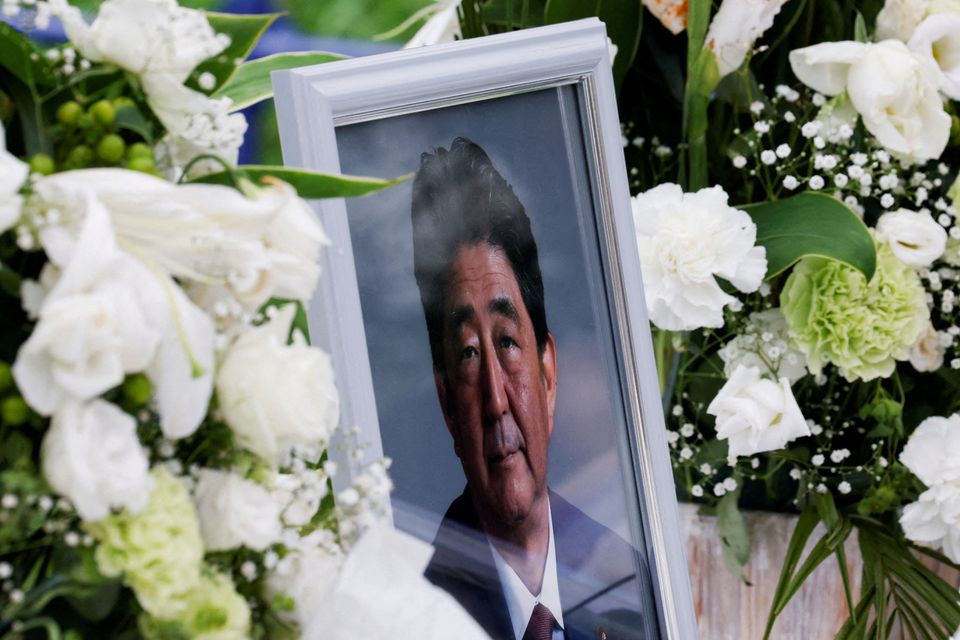 A picture of late former Japanese Prime Minister Shinzo Abe, who was gunned down while campaigning for a parliamentary election, is seen at Headquarters of the Japanese Liberal Democratic Party in Tokyo, Japan July 12, 2022. REUTERS/Kim Kyung-Hoon

