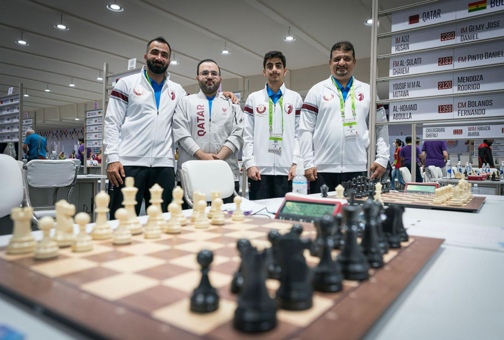 Qatar players pose for a group photo.