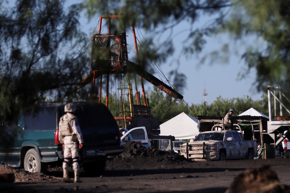 Soldiers keep watch at the facilities of a coal mine that collapsed leaving miners trapped, in Sabinas, in Coahuila state, Mexico, August 3, 2022. REUTERS/Antonio Ojeda 