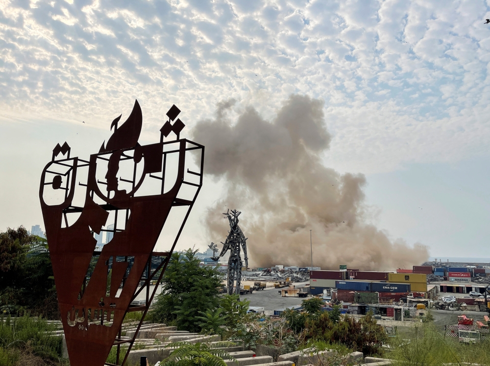 Smoke rises from the newly collapsed part of the Beirut grain silos damaged during August 2020 blast as Lebanon marks the two-year anniversary of the explosion, in Beirut, Lebanon, August 4, 2022. (REUTERS/Issam Abdallah)