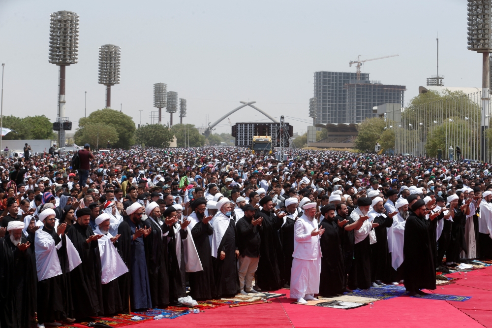 Supporters of Iraqi populist leader Moqtada al-Sadr gather for mass Friday prayer at Grand Festivities Square within the Green Zone, in Baghdad, Iraq, August 5, 2022. (REUTERS/Alaa al-Marjani)