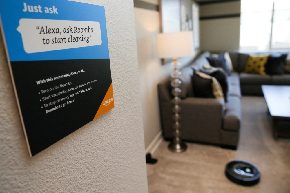 File Photo: Prompts on how to use Amazon's Alexa personal assistant are seen as a wifi-equipped Roomba begins cleaning a room in an Amazon ‘experience center’ in Vallejo, California, US, May 8, 2018. (REUTERS/Elijah Nouvelage)