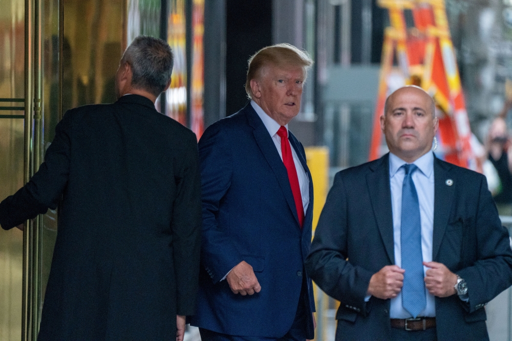 Former US President Donald Trump departs Trump Tower for a deposition two days after FBI agents raided his Mar-a-Lago Palm Beach home, in New York City, August 10, 2022. (REUTERS/David 'Dee' Delgado)