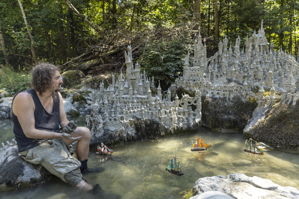 Land art artist Francois Monthoux works on his 