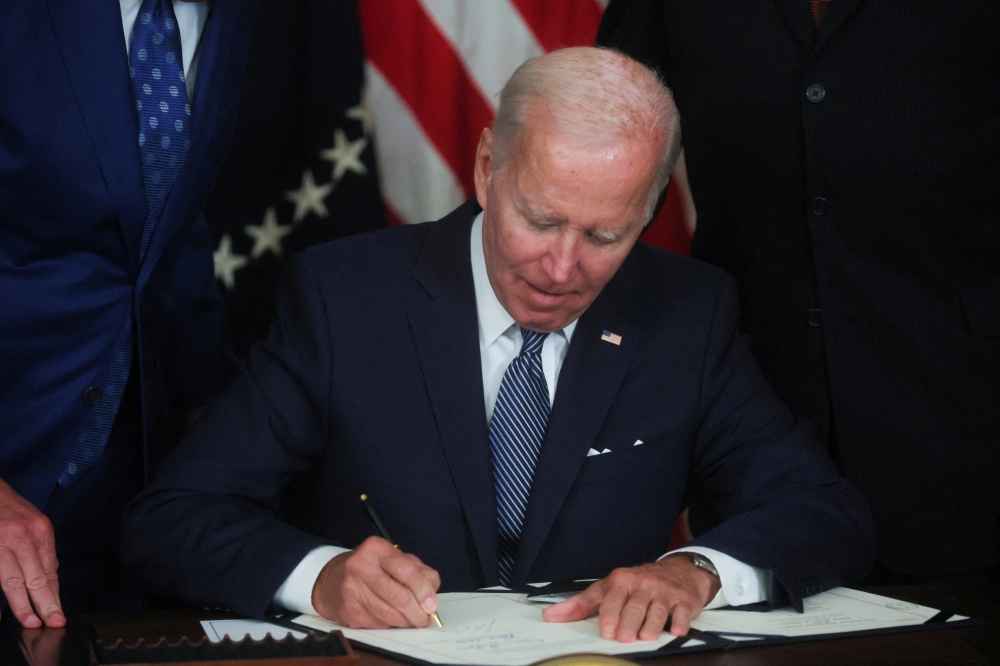 US President Joe Biden signs 
