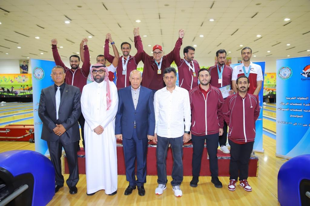 Qatar’s players and officials celebrate a silver medal yesterday. 