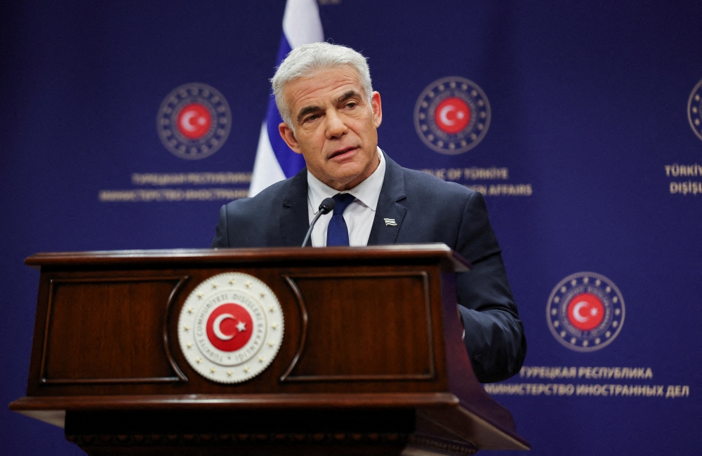 File Photo: Israel's Foreign Minister Yair Lapid speaks during a news conference as he meets Turkey's Foreign Minister Mevlut Cavusoglu in Ankara, Turkey, June 23, 2022. (REUTERS/Umit Bektas)