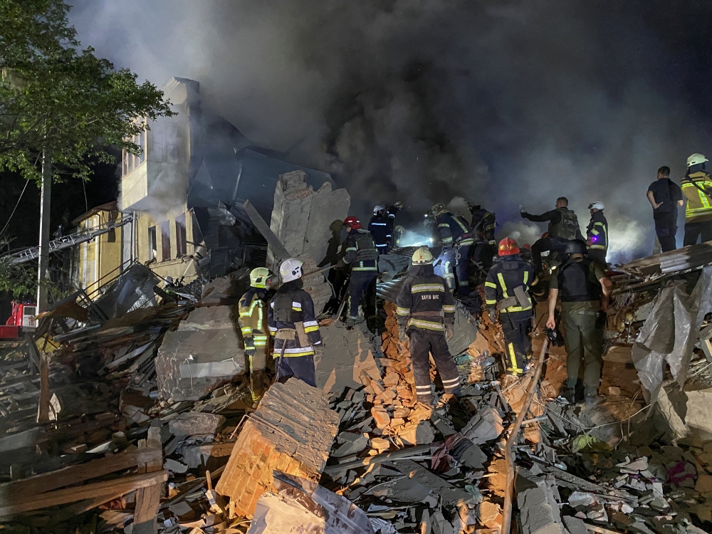 Rescuers work at the site of a residential building destroyed by a Russian missile strike, amid Russia's attack on Ukraine, in Kharkiv, Ukraine August 17, 2022. REUTERS/Vitalii Hnidyi