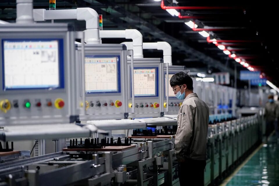 An employee works on the production line of electric vehicle (EV) battery manufacturer Octillion in Hefei, Anhui province, China March 30, 2021. Picture taken March 30, 2021. REUTERS/Aly Song


