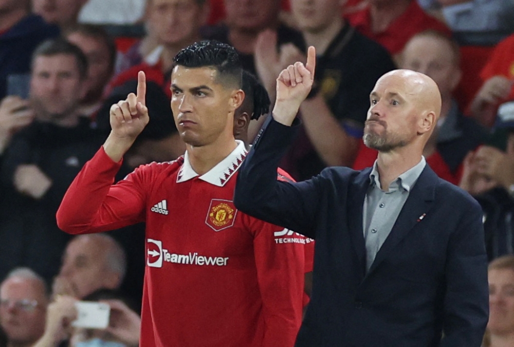 Manchester United's Cristiano Ronaldo with manager Erik ten Hag before coming on as a substitute during the match against Liverpool at Old Trafford, Manchester, on August 22, 2022. Reuters 