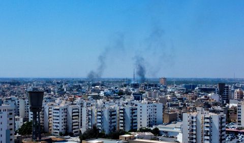 Smoke rises in the sky following clashes in Tripoli, Libya August 27, 2022. REUTERS/Hazem Ahmed