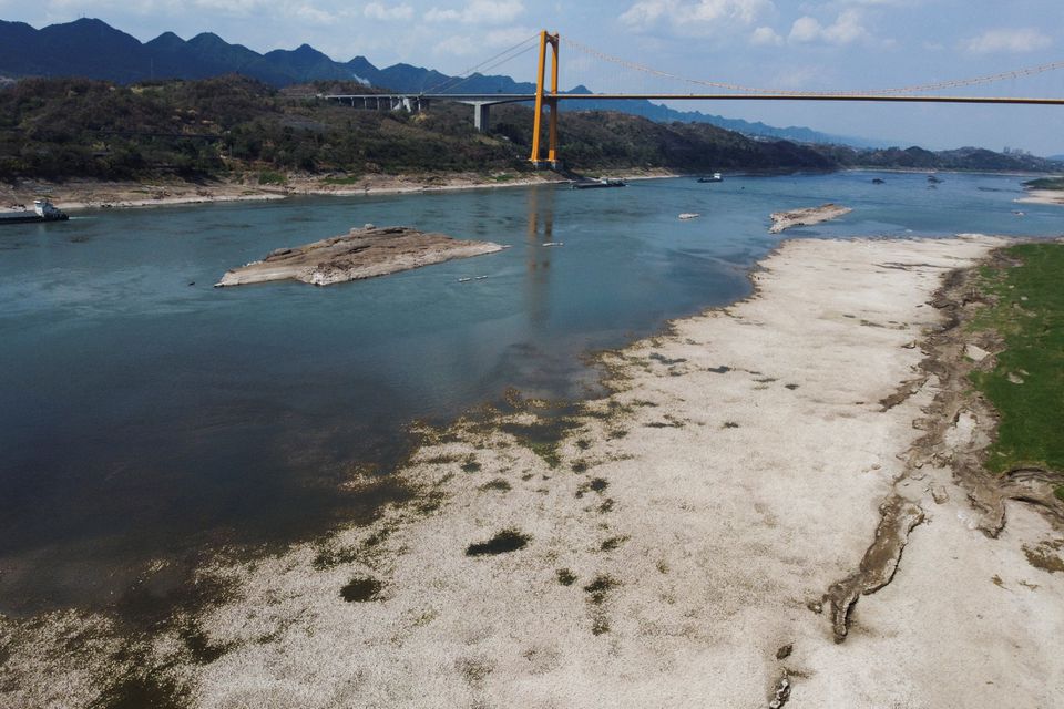 An aerial view shows the Yangtze river that is approaching record-low water levels during a regional drought in Chongqing, China, August 20, 2022. REUTERS/Thomas Peter


