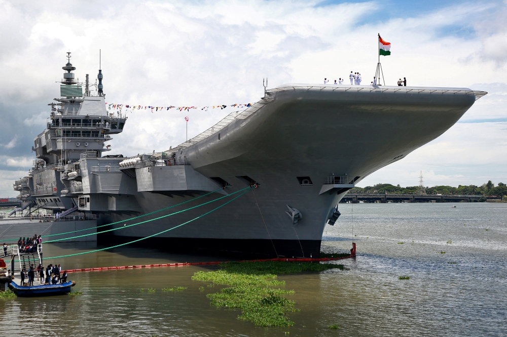 Indian Navy officers stand on the flight deck of India's first home-built aircraft carrier INS Vikrant after its commissioning ceremony at a state-run shipyard in Kochi, India, September 2, 2022. Reuters/Sivaram V
