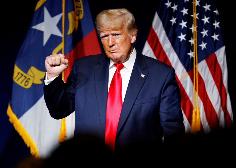 Former US President Donald Trump makes a fist while reacting to applause after speaking at the North Carolina GOP convention dinner in Greenville, North Carolina, on June 5, 2021.  File Photo / Reuters
