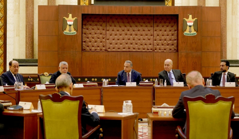 Iraqi Prime Minister Mustafa al-Kadhimi and Iraqi President Barham Salih and Iraqi speaker of Parliament Mohammed al-Halbousi meet with the leaders of the Iraqi national political parties, in Baghdad, on September 5, 2022.  Iraqi Prime Minister Media Office/Handout via REUTERS