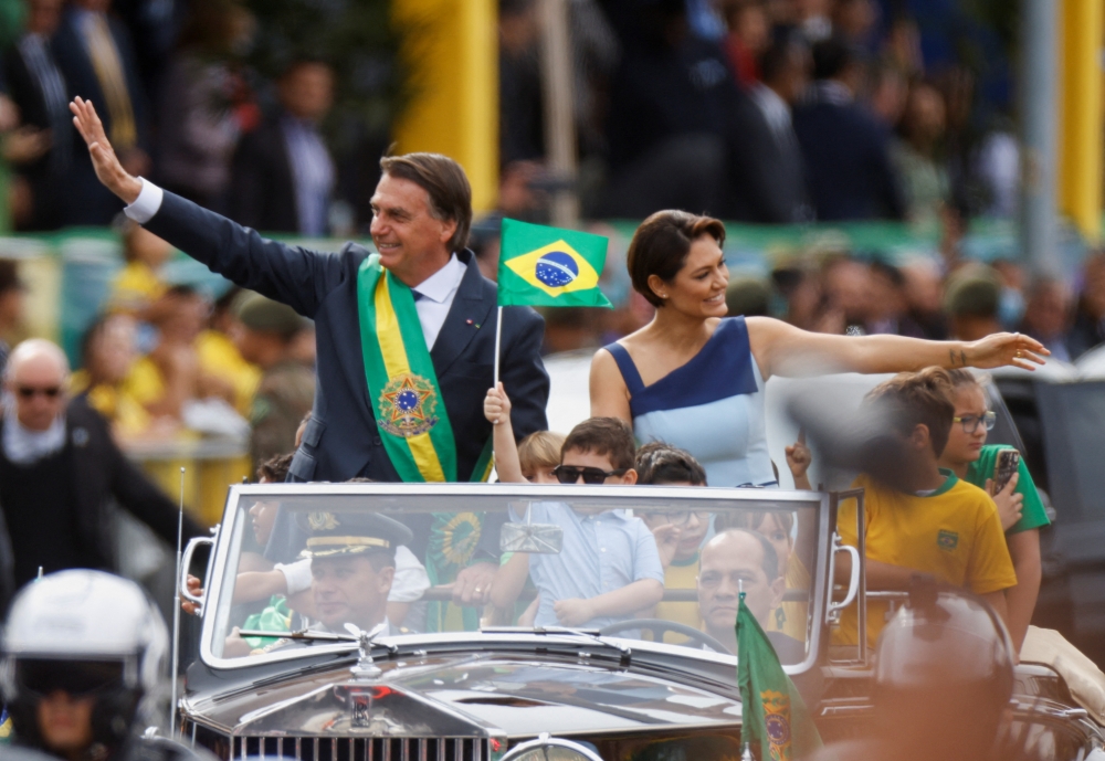 Brazil's President Jair Bolsonaro waves from a vehicle during a military parade to celebrate the bicentennial independence of Brazil, in Brasilia, on September 7, 2022. REUTERS/Adriano Machado