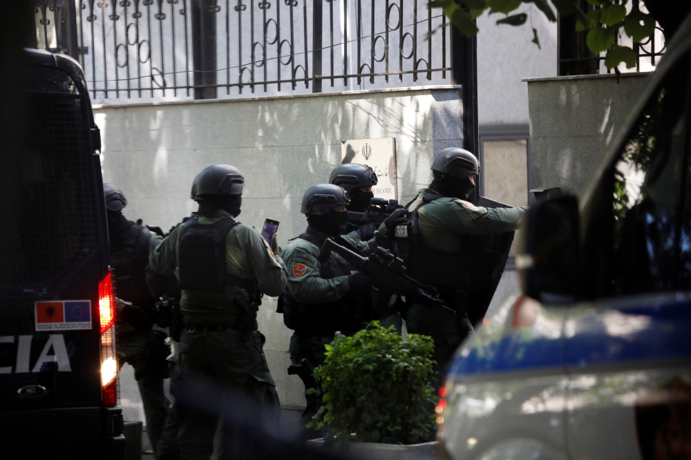 Members of the police special unit enter the Embassy of the Islamic Republic of Iran, as Albania cuts ties with Iran and orders diplomats to leave over cyberattack, in Tirana, Albania, on September 8, 2022. REUTERS/Florion Goga