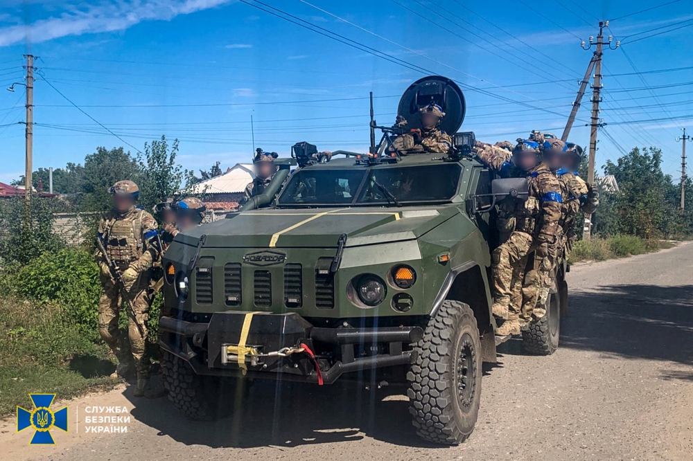 Service members of the State Security Service of Ukraine patrol of an area of the recently liberated town of Kupiansk, amid Russia's attack on Ukraine, in Kharkiv region, Ukraine in this handout picture released on September 10, 2022. Press Service of the State Security Service of Ukraine/Handout via REUTERS