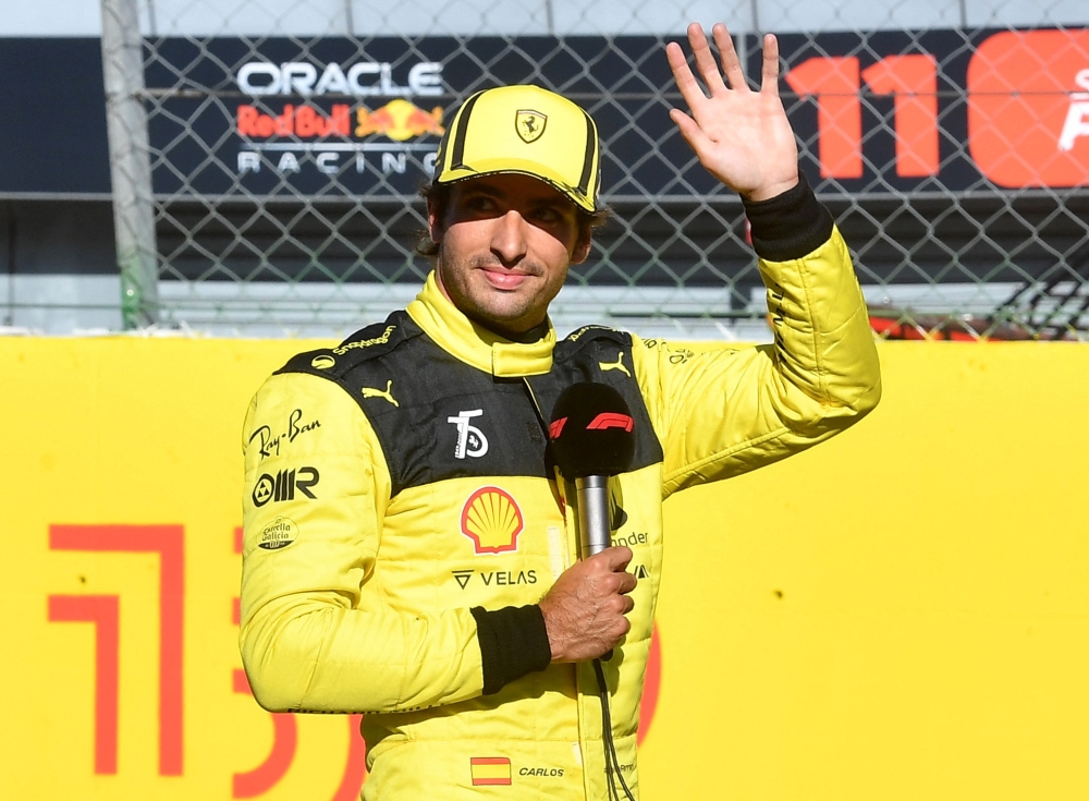 Ferrari's Charles Leclerc gives a speech after qualifying in pole position at the Italian Grand Prix in Autodromo Nazionale Monza, Monza, on September 10, 2022.   REUTERS/Jennifer Lorenzini