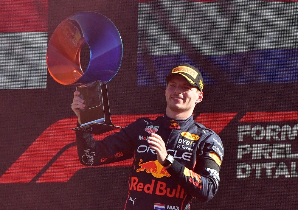 Red Bull's Max Verstappen celebrates with the trophy on the podium after winning the Italian Grand Prix at Autodromo Nazionale Monza, Monza, Italy, on September 11, 2022. (REUTERS/Jennifer Lorenzini)