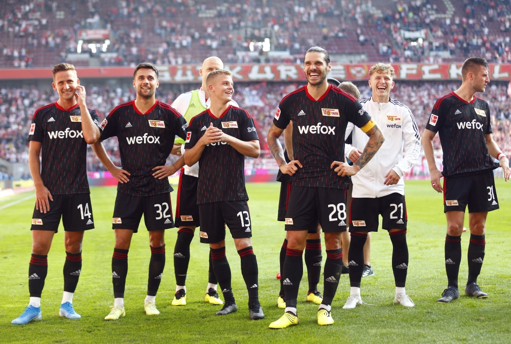 FC Union Berlin players celebrate after winning their German Bundesliga match against  FC Cologne at the RheinEnergieStadion in Cologne on September 11, 2022 1.  REUTERS/Thilo Schmuelgen 