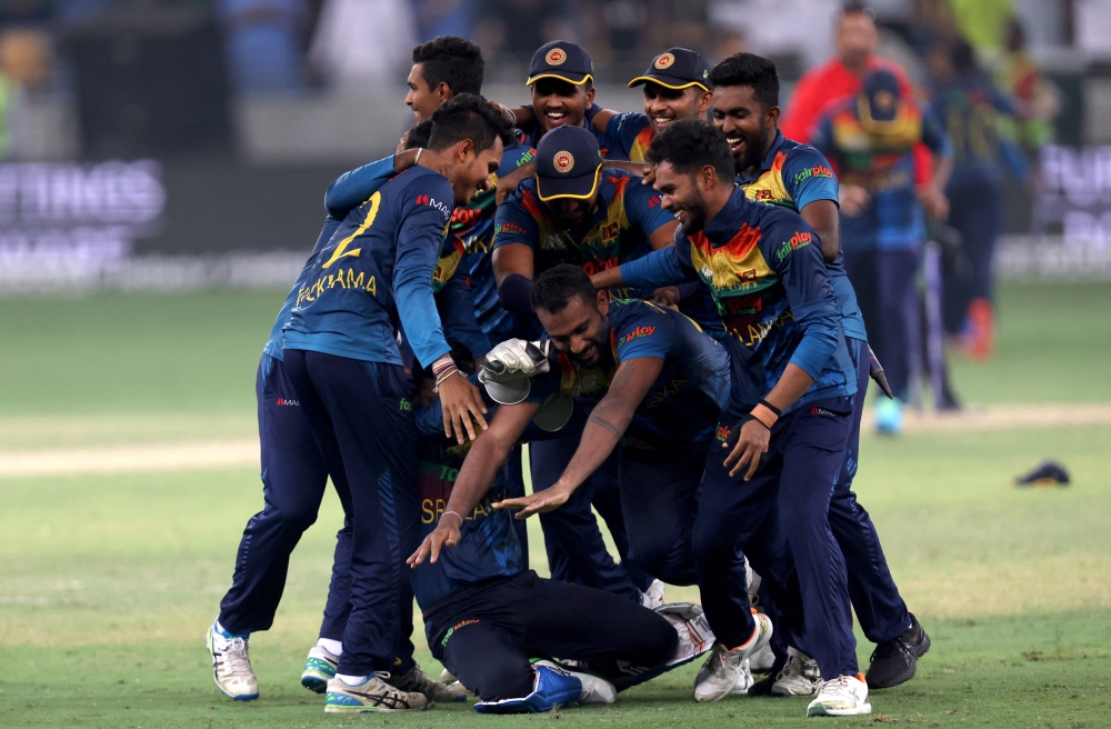 Sri Lanka players celebrate after winning the final match of the Asia Cup against Pakistan at the Dubai International Stadium in Dubai on September 11, 2022.  REUTERS/Christopher Pike