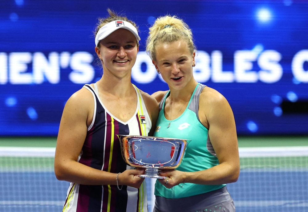 Czech Republic's Katerina Siniakova and Barbora Krejcikova celebrate with the trophy after winning the women's doubles final against Caty McNally and Taylor Townsend of the US.  Reuters/Mike Segar