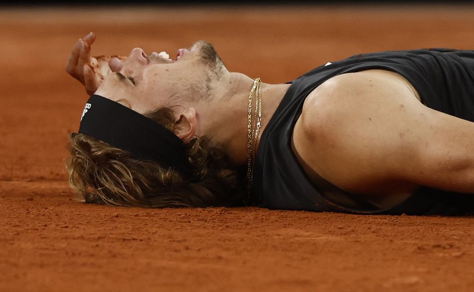 June 3, 2022 Germany's Alexander Zverev reacts after sustaining an injury during his semi final match against Spain's Rafael Nadal REUTERS/Yves Herman/Files



