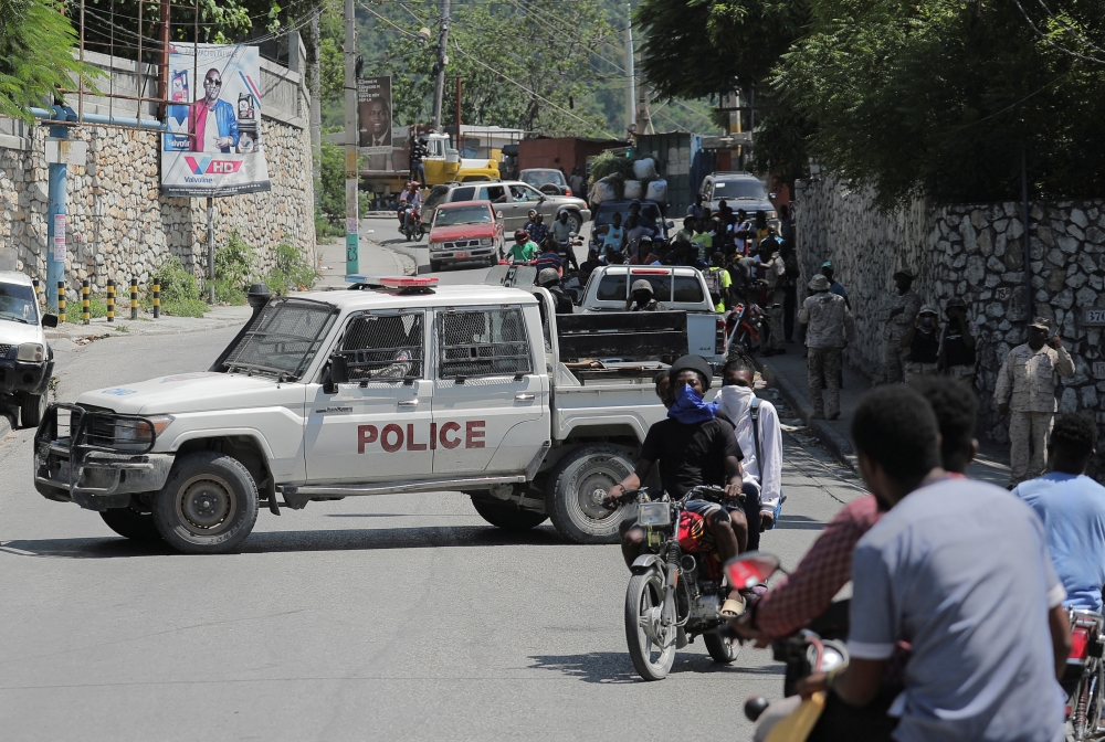 Haitian National Police officers keep watch during a protest demanding the resignation of Prime Minister Ariel Henry, in Port-au-Prince, Haiti, on September 11, 2022. REUTERS/Ralph Tedy Erol