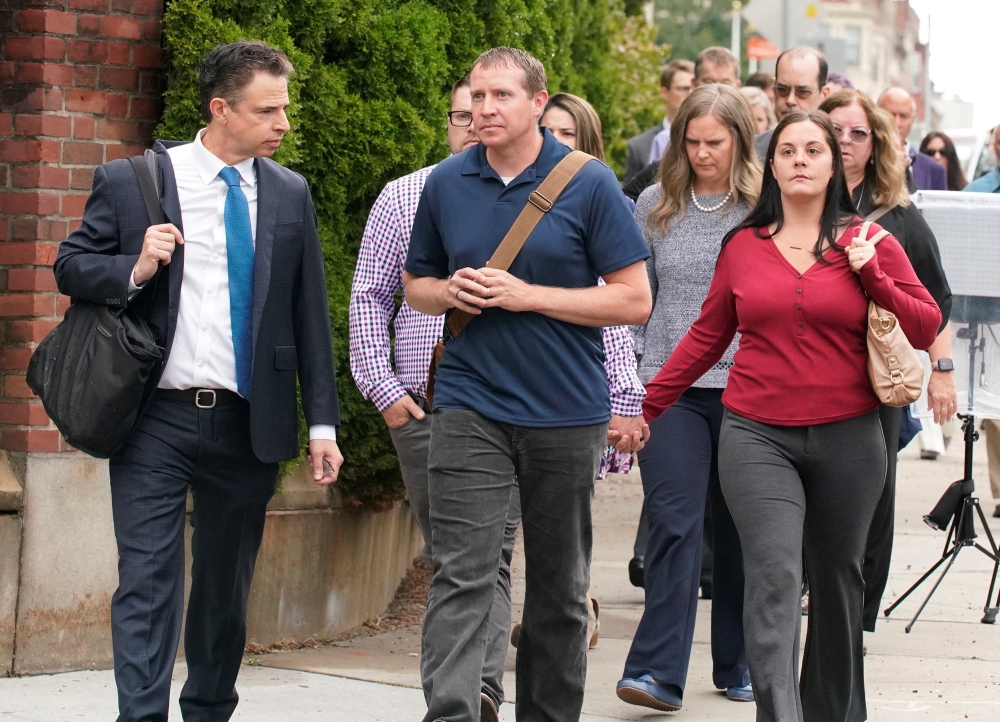 Family members of victims of the Sandy Hook Elementary School shooting arrive at the court house as Alex Jones faces a second defamation trial over Sandy Hook claims in Waterbury, Connecticut, on September 13, 2022. REUTERS/Michelle McLoughlin