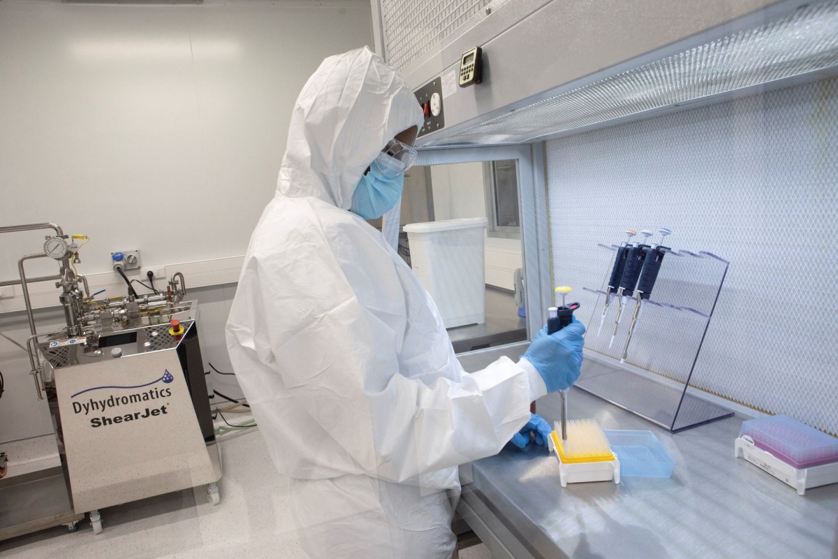 A production scientist works with samples during a visit by representatives of the Medicines Patent Pool, France and other European Union member states, at the Afrigen Biologics' site in Cape Town, South Africa, on February 3, 2022. REUTERS/Shelley Christians