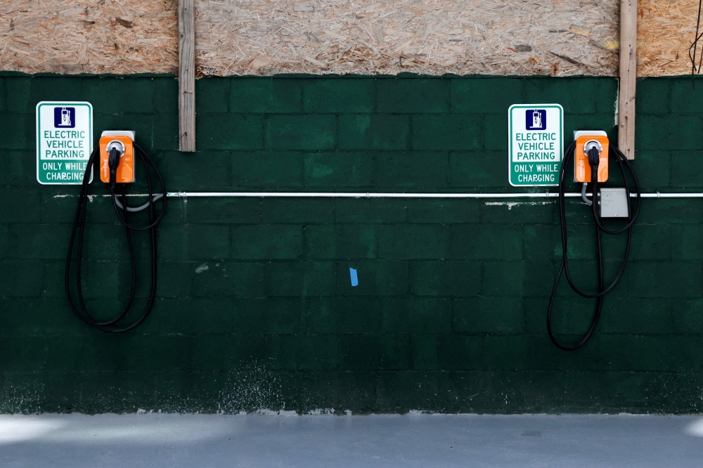 A view show EV Charging stations in the parking area of Timber House, the city's first mass-timber condo building, in the Park Slope neighborhood of Brooklyn, New York, U.S., August 16, 2022. REUTERS/Brendan McDermid/File Photo