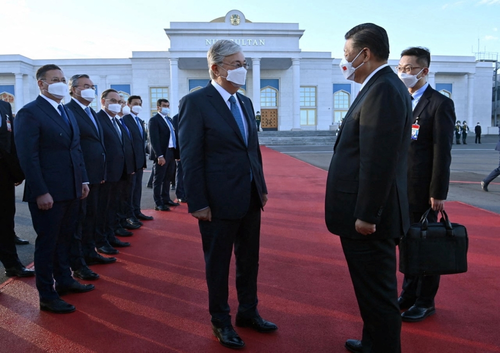 Chinese President Xi Jinping says goodbye to Kazakh President Kassym-Jomart Tokayev before boarding a plane at the airport in Nur-Sultan, Kazakhstan, on September 14, 2022. Press service of the President of Kazakhstan/Handout via REUTERS