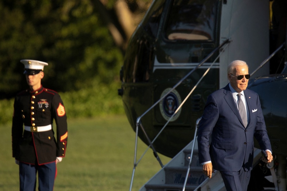US President Joe Biden walks from Marine One to the White House following a trip from Michigan, in Washington on September 14, 2022. REUTERS/Tom Brenner