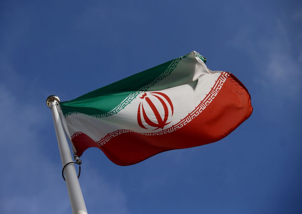 The Iranian flag waves in front of the International Atomic Energy Agency (IAEA) headquarters, before the beginning of a board of governors meeting in Vienna, Austria, on March 1, 2021. File Photo / Reuters
