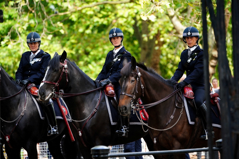 Mounted Metropolitan Police outside Wellington Barracks, central London, ahead of the ceremonial procession of the coffin of Queen Elizabeth II from Buckingham Palace to Westminster Hall, London. Picture date: Wednesday September 14, 2022. Ben Birchall/Pool via REUTERS/File Photo