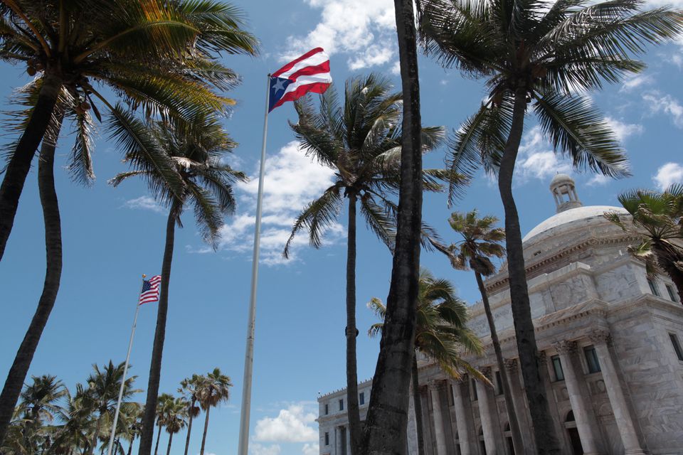 The flags of the US and Puerto Rico fly outside the Capitol building in San Juan, Puerto Rico, on May 4, 2017.  File Photo / Reuters
