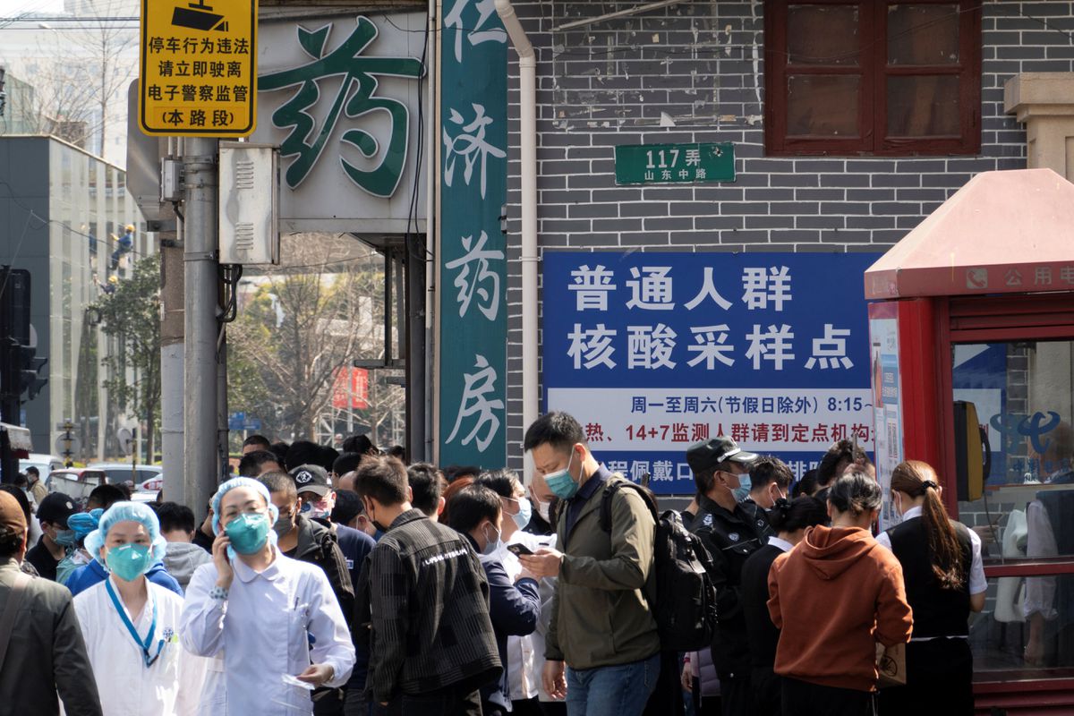 File Photo: Residents line up outside a nucleic acid testing site of a hospital, following cases of the coronavirus disease (COVID-19), in Shanghai, China, March 11, 2022. (REUTERS)
